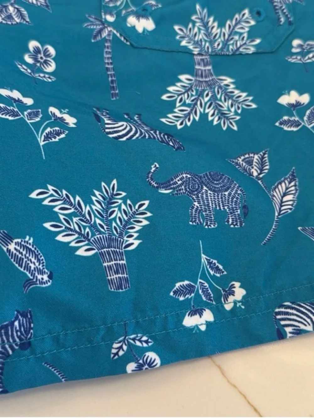 Janie and Jack Teal World Love Swim Trunks with Animal Print